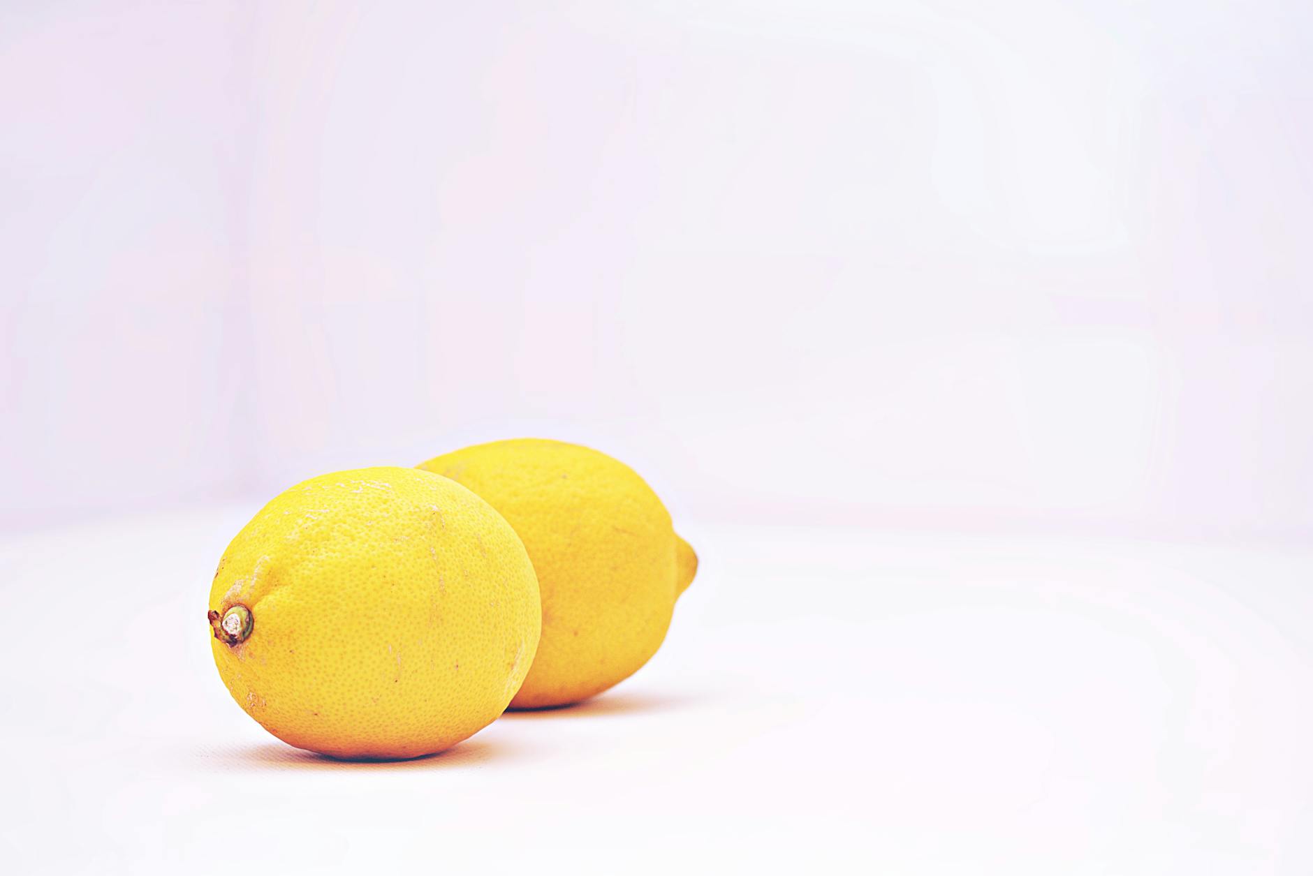 Fresh lemons on a white background, symbolizing new beginnings and fresh starts